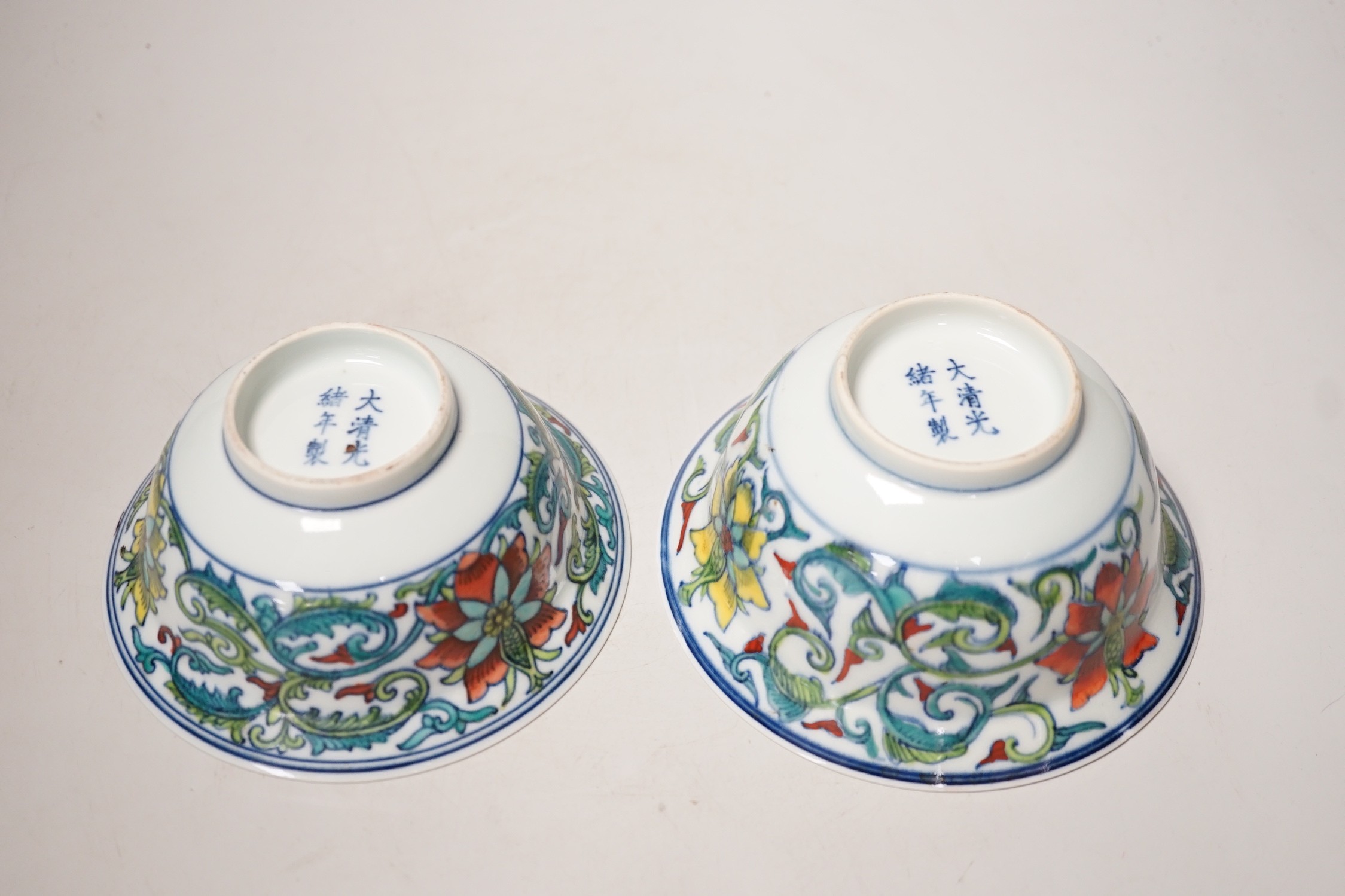 A near pair of Chinese doucai bowls. Tallest 7cm